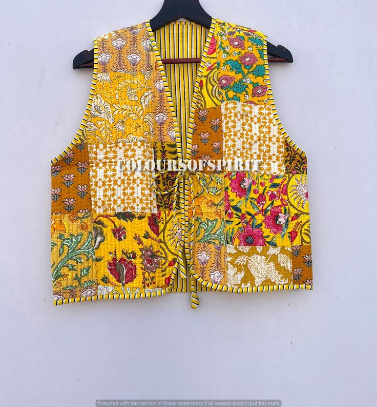 Beautiful Handmade Printed Cotton Fabric Quilted Winter Vest Embroidery Coat Quilted Vest Cotton Vest Handmade Reversible Coat, Three Layer Vest. This is a Gorgeous Piece Of Cotton block printed quilted vest jacket. It is one of a kind jacket and a unique piece. Measurements all different jackets . Small Size - Chest -38 inch Length- 20.5 inch Arm Hole- 23 Inch Medium Size - Chest-40 inch Length- 20.5 inch Arm Hole- 23 Inch Large Size - Chest- 42 Inch Length- 21 inch Arm Hole- 24 Inch Shoulder - Fitted Cotton Outerwear For Festivals, Folk Style Cotton Outerwear For Spring, Folk Style Cotton Outerwear For Fall, Cotton Patchwork Outerwear For Festivals, Fitted Cotton Folk Outerwear, Folk Style Fitted Cotton Outerwear, Festival Cotton Outerwear With Patchwork, Festival Cotton Patchwork Outerwear, Fitted Folk-style Cotton Outerwear