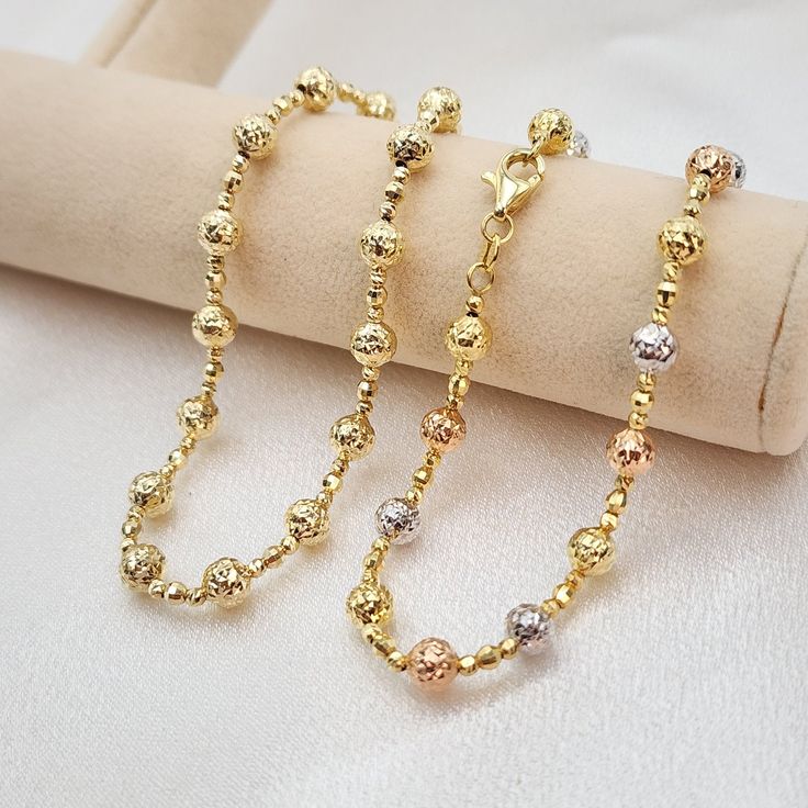 Stunning real 14k white, yellow and rose or plain 14k yellow gold diamond cut bead bracelet. Perfect for everyday and every occasion. Unique, shiny and elegant. This bracelet will make the perfect gift. 14k gold will not tarnish or rust.  Real 14k gold. Not plated, not vermeil. Materials: 14k white, yellow and rose gold Lenght: 7.5 Inches Thickness: - Big bead 5mm  - small bead 2mm Weight: 3.6 grams 14k stamped Brand new For her  Briza Collections is a small family owned business that works hard Solid Gold Jewelry, Gold Plated Bracelets, Small Family, Diamond Cut, Bead Bracelet, Gold Beads, Beaded Chain, Chain Lengths, Gold Diamond