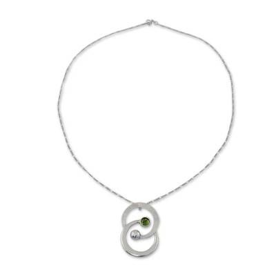 Working in sterling silver Mariana Llanes pays tribute to the zodiac sign of Gemini. The finely handcrafted necklace features peridot's green tonalities. .925 Sterling silver Fine Jewelry Silver Necklace For May Birthstone, Silver Fine Jewelry Necklace For May Birthstone, Silver Necklace For May Birthstone Anniversary, Silver Necklace For Anniversary With May Birthstone, Round Peridot Birthstone Necklace, Peridot Necklace With Round Pendant For Gift, Fine Jewelry Peridot Necklace For May Birthstone, Sterling Silver Necklaces With May Birthstone, Anniversary Peridot Birthstone Necklace