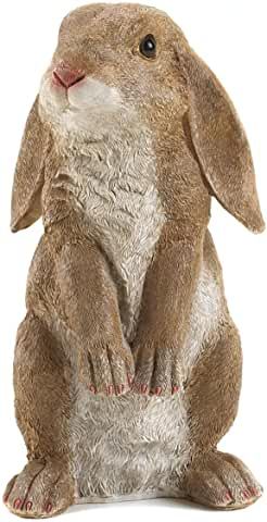 a statue of a brown rabbit sitting on its hind legs and looking at the camera