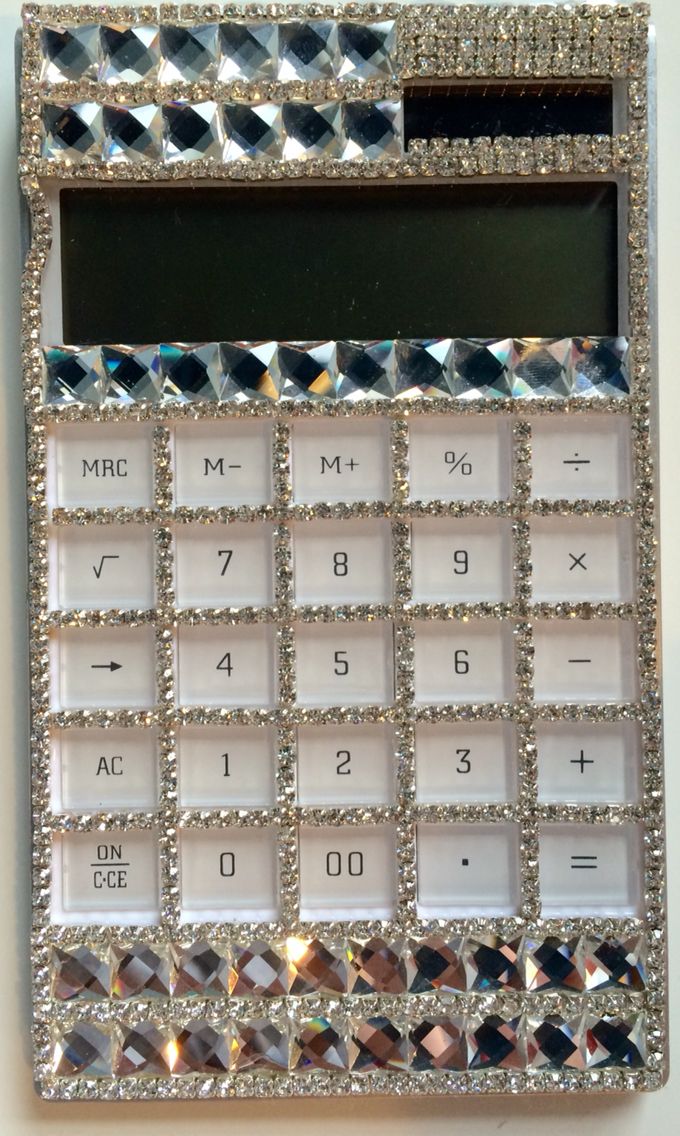 a calculator with lots of diamonds on it's display case is shown