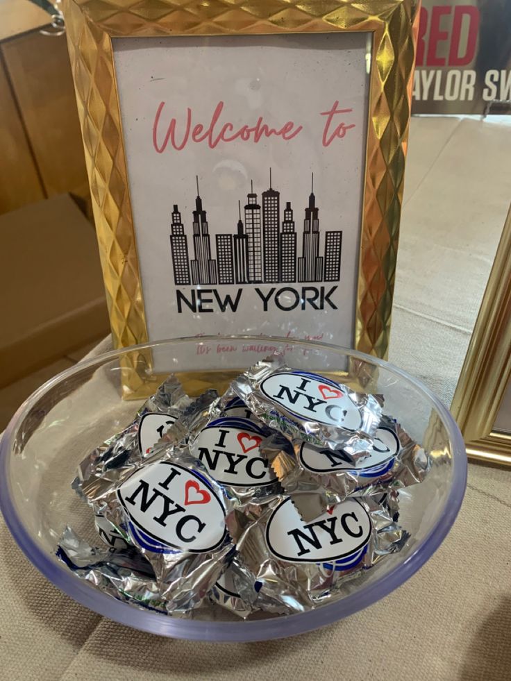 new york city souvenirs displayed in front of a welcome sign