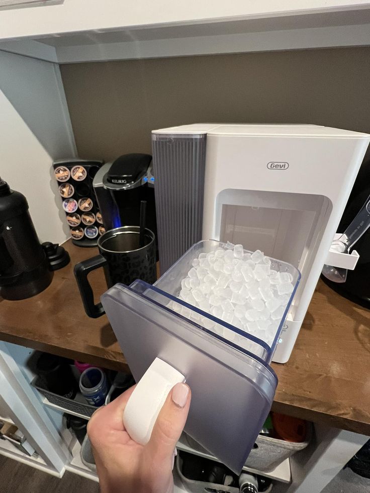 a person is opening up an ice chest