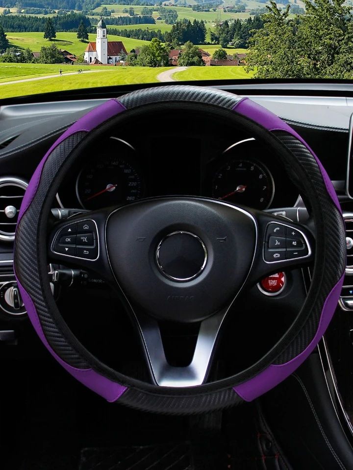 the steering wheel cover is purple and black