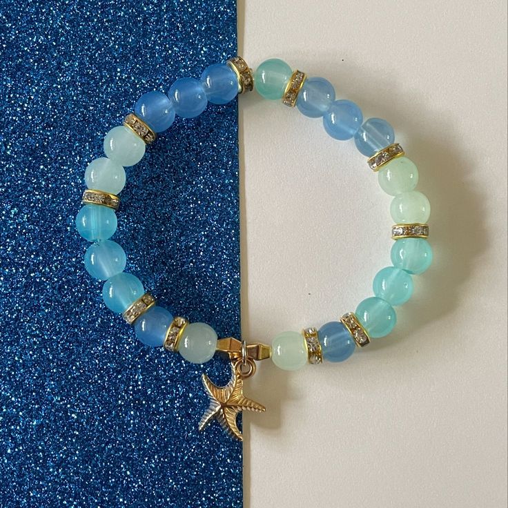 cute beachy bracelet! Beachy Bracelets Beads, Adjustable Blue Jewelry With Starfish Charm, Adjustable Blue Starfish Jewelry, Turquoise Beaded Bracelets With Starfish Charm, Bohemian Turquoise Starfish Beaded Bracelets, Bohemian Blue Jewelry With Starfish Charm, Bohemian Blue Starfish Charm Jewelry, Blue Bracelets With Starfish Charm And Round Beads, Blue Bracelet With Starfish Charm And Round Beads