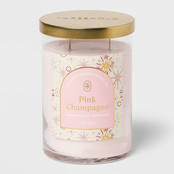 pink champagne candle with gold lid