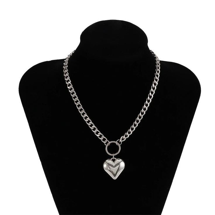 Unleash Your Edgy Side with a Touch of Elegance Step into the world of bold fashion with our Heart Pendant Punk Choker, a perfect blend of edgy punk style and feminine charm. This short-style necklace, designed for the modern woman, features a striking heart pendant hanging from a sturdy metal link chain. Its iron alloy construction ensures durability while offering a gleaming finish that captures the eye. Ideal for parties, casual outings, or adding a daring twist to your daily wear, this choke Punk Jewellery, Vintage Statement Jewelry, Simple Choker, Short Fashion, Punk Jewelry, Personalized Pendant, Estilo Punk, Link Chain Necklace, Style Punk