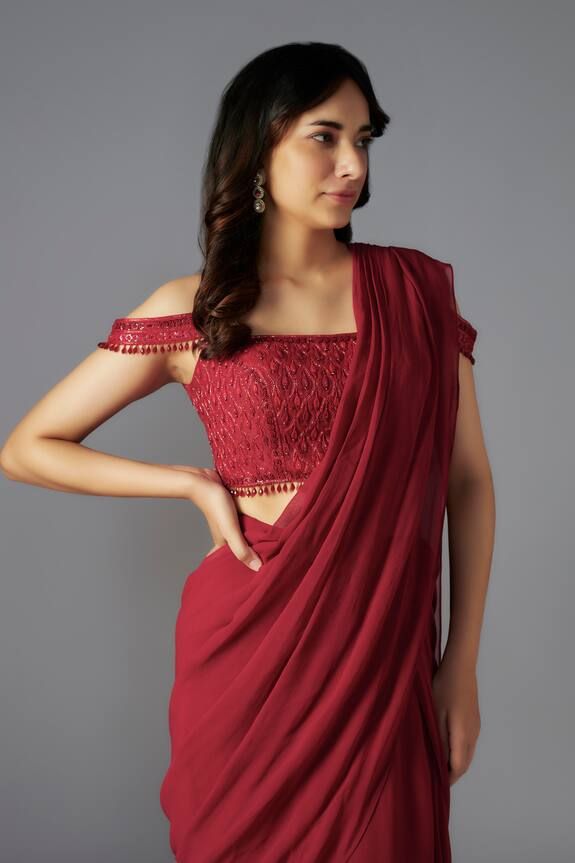 Red solid pre-draped saree.Comes with padded off shoulder blouse embellished by sequin and bead geometric patterns. - Aza Fashions Elegant Red Choli With Unstitched Blouse, Elegant Red Unstitched Choli Blouse, Red Pre-draped Saree With Zari Work For Evening, Elegant Red Unstitched Choli, Red Bollywood Blouse Piece For Evening, Evening Pre-draped Red Saree With Zari Work, Elegant Red Choli With Traditional Drape, Bollywood Style Red Blouse Piece For Evening, Elegant Red Blouse Piece For Evening