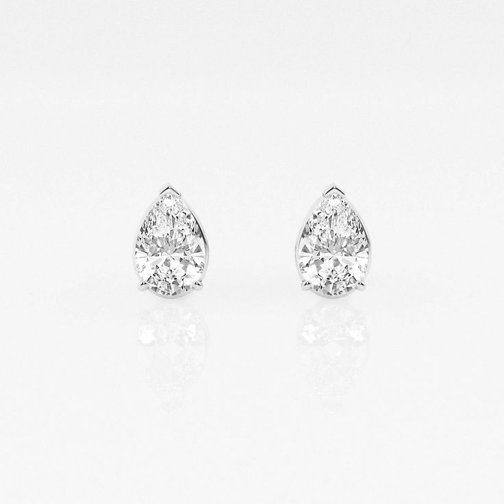 pair of diamond earrings on white background