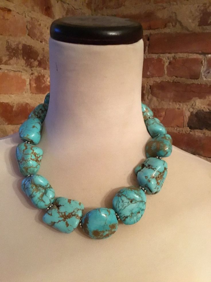 This stunning 18 inch necklace consists of turquoise howlite beads. This necklace is absolutely beautiful!  Please note that there are natural imperfections in the craftsmanship of the pendant as well as natural imperfections in the beads.  The necklace weights approximately 12 ounces and promises to make a statement! Color may vary slightly due to the color calibration of each individual monitor. The pictures simply cannot capture the detail and the beauty of this necklace. Turquoise Stones Necklace, Elegant Turquoise Necklace With Large Beads, Turquoise Howlite Beaded Necklace With Gemstone Beads, Turquoise Howlite Gemstone Beaded Necklaces, Turquoise Howlite Gemstone Beaded Necklace, Turquoise Necklace With Large Beads, Handmade Turquoise Howlite Beaded Necklaces, Blue Turquoise Howlite Necklace With Round Beads, Turquoise Necklace With Natural Round Beads