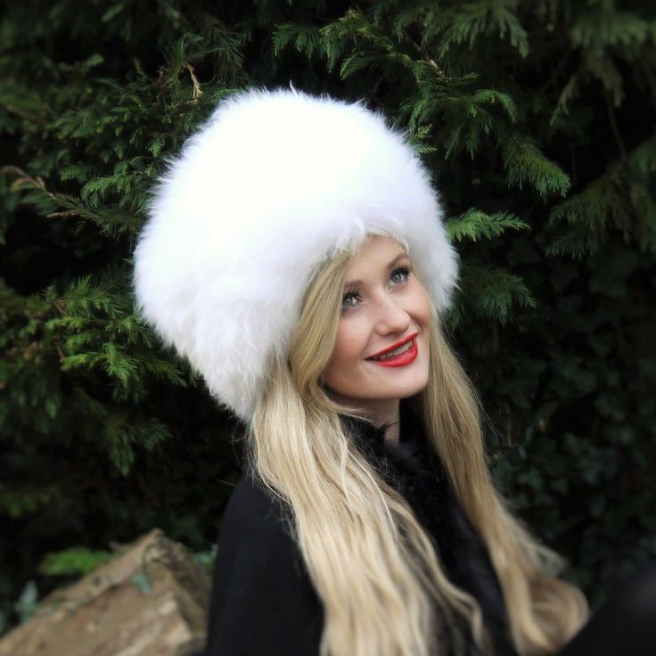 We have been handcrafting these in our Somerset Workshop since 1988, using the traditional methods with nothing but the finest British sheepskin. For a throughly British and luxurious Hat, look no further than our timeless, classic Cossack. These handmade Sheepskin Cossack Hats are perfect for keeping your head toasty warm on frosty winter days! Fantastic with the matching Sheepskin Boots, from walking the dog to a winter wedding - they are marvellous for any occasion. We make them with long fur Classic White Hat Bands For Winter, White Fur Felt Hat For Winter, White Fur Felt Winter Hat, Elegant White Hat Bands For Winter, Elegant White Winter Hat Bands, Cossack Hat, Sheepskin Boots, Black Panels, Winter Days