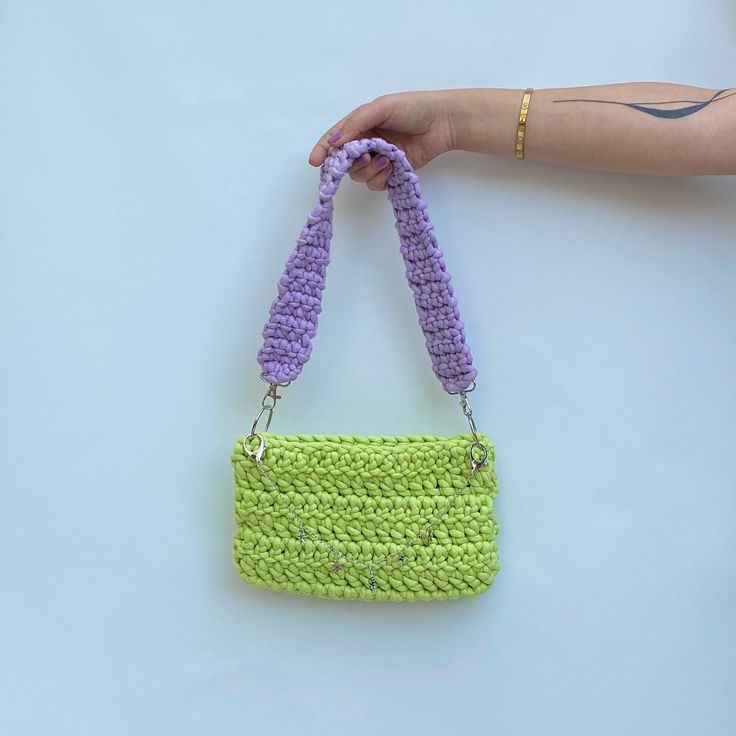 "\"Handmade Neon Green and Purple Mini Tote Bag - Where Vibrancy Meets Elegance\" Description: Hello and welcome! We are delighted to introduce our handmade mini tote bag to you, crafted with cotton yarn filled with fiber and adorned with the energy of neon green and the charm of purple. Features: Hand-knitted and entirely handmade. Soft, durable, and perfect for daily use. Compact in size, measuring 25cm x 15cm. The vibrancy of neon green and the allure of purple make this bag truly special. This mini tote bag is a perfect choice for various purposes, from daily shopping to special events. It can also serve as a wonderful gift option for your loved ones. Since each bag is handmade, they are all unique and crafted with great care. If you desire this striking handmade mini tote bag and the Red Crop Jacket, Knitted Tote Bag, Hand Knit Bag, Mint Green Sweater, Crochet Beach Bags, Knitting Tote Bag, Knitted Bag, Woman Bag, Crochet Market Bag