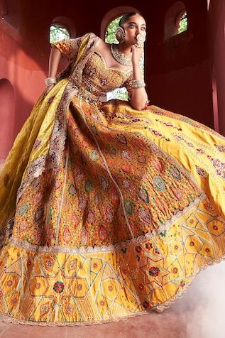 Mustard yellow jamawar attached cancan panelled lehenga in floral geometric pattern with resham, zari and pearl hand embroidery. Paired with a matching padded blouse embellished with resham, pearl and zari embroidery, dupatta in shimmer tissue base with zari border and embellished belt. - Aza Fashions Yellow Sets With Motifs For Transitional Season, Transitional Yellow Sets With Motifs, Transitional Yellow Choli With Dupatta, Traditional Yellow Choli With Meenakari, Transitional Yellow Lehenga With Motifs, Yellow Traditional Wear With Meenakari For Wedding, Transitional Yellow Lehenga With Cutdana, Traditional Yellow Anarkali Set With Motifs, Yellow Anarkali With Motifs