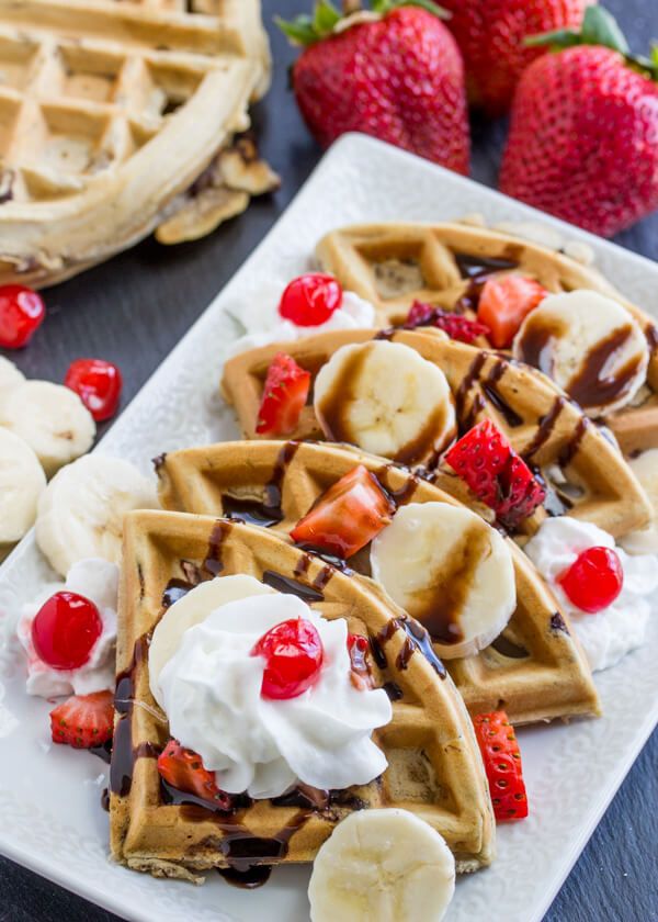 waffles with bananas, strawberries and whipped cream