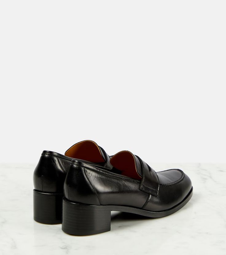 Vera leather loafer pumps in black - The Row | Mytheresa Elegant Slip-on Calf Leather Loafers, Office Heels With Square Toe And Rubber Sole, Office Heels With Rubber Sole And Square Toe, Square Toe Heels With Rubber Sole For Office, Office Leather Shoes With Closed Toe, Calf Leather Pointed Toe Slip-ons For Work, Office Leather Shoes With Almond Toe And Branded Heel, Elegant Leather-lined Pointed Toe Slip-ons, Slip-on Loafers With Branded Heel Counter