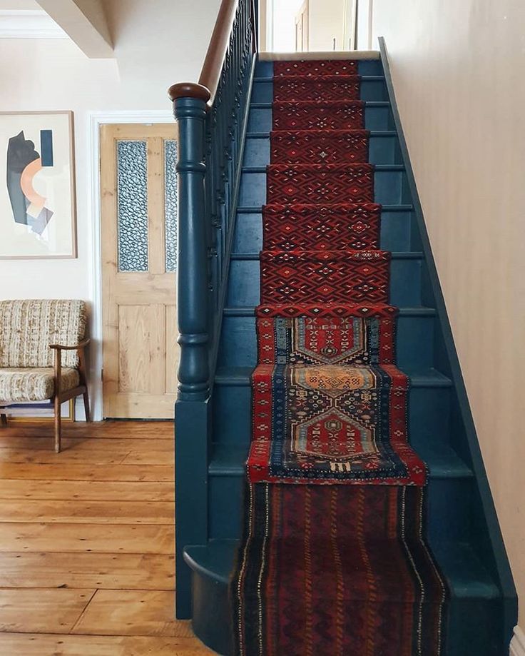 an instagram page with stairs and rugs on it