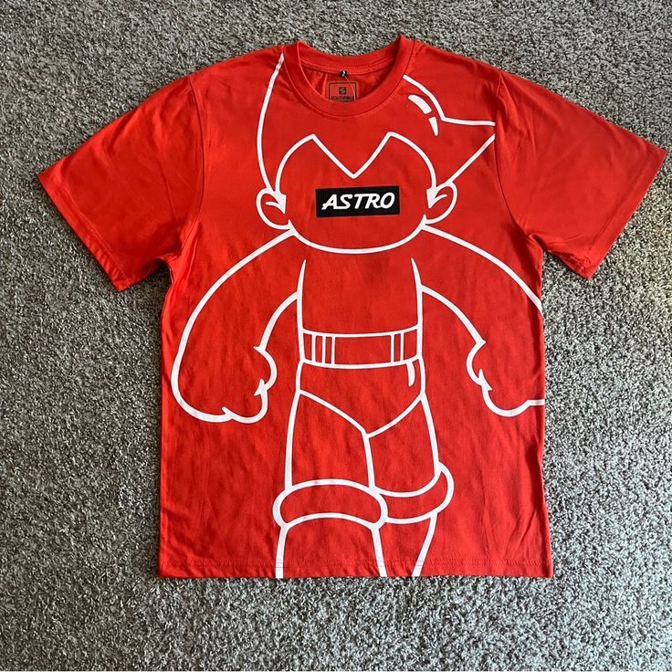 Southpole Astro Boy Graphic T-Shirt Men’s Short Sleeves Size Large Orange New Casual Crew Neck T-shirt With Character Print, Sporty Character Print Tops For Streetwear, Sporty Cotton Tops With Cartoon Print, Urban Crew Neck Top With Cartoon Print, Red Cotton T-shirt With Cartoon Print, Urban Red Crew Neck Shirt, Urban Crew Neck T-shirt With Cartoon Print, Urban Cartoon Print Crew Neck T-shirt, Urban Style Short Sleeve T-shirt With Cartoon Print