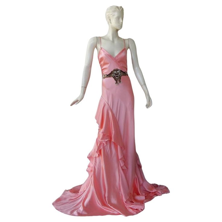 One of the most coveted styles from Gucci's 2016 runway collection by Alessandro Michele. Features fitted bodice expanding into a fully fashioned rich pink silk spaghetti strap bias gown. Full skirt boasts a side ruffle adornment. Rich burgundy velvet tie belt with mounted center beaded tiger face. A fabulous timeless style with fashion impact and dramatic presence. Size: 42: bust: 34" waist: 28"; hips: approx: 40"; length: approx 65"+ Condition: excellent; dress is beautifully cleaned Gucci Silk Dress For Wedding, Gucci Silk Wedding Dress, Gucci Floor-length Evening Dress, Glamorous Fitted Gucci Dress, Luxury Fitted Slip Dress For Wedding, Gucci Silk Dress For Gala, Silk Gown With Spaghetti Straps For Wedding, Pink Luxury Gown With Fitted Bodice, Luxury Pink Gown With Fitted Bodice