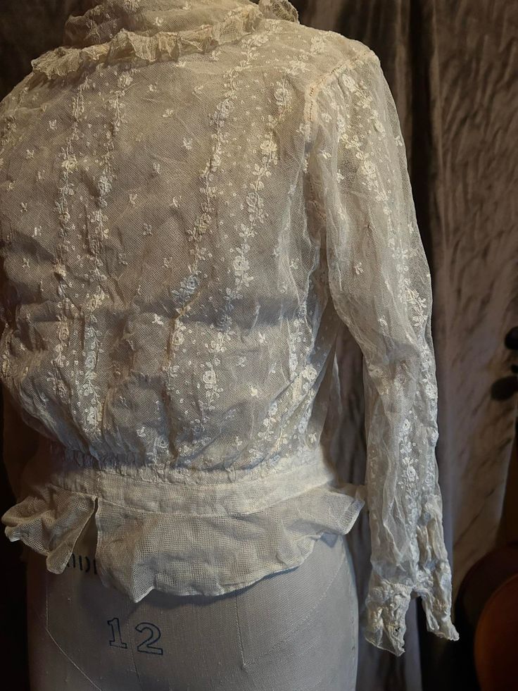 Delicate original condition Edwardian cream/white lace blouse personally sourced directly from the brocante markets of France. Almost perfect condition, just a small tear in the undernet layer under the right armhole, all back hooks in tact. Beautiful lace collar and cuff details. Quite wearable, small size with hook and eye back undernet layer. 32 inch bust, 24 inch waist, 14 inch armscye, 17 inches in length from the shoulder to the hem. Vintage Lace Tops For Formal Occasions, Formal White Lace Work Blouse, Classic Lace Blouse, Classic Lace Tops With Lace Work, Classic Lace Tops For Wedding, Formal White Blouse With Lace Work, White Broderie Anglaise Top For Wedding, Elegant Broderie Anglaise Lace Top For Daywear, Classic White Lace Blouse