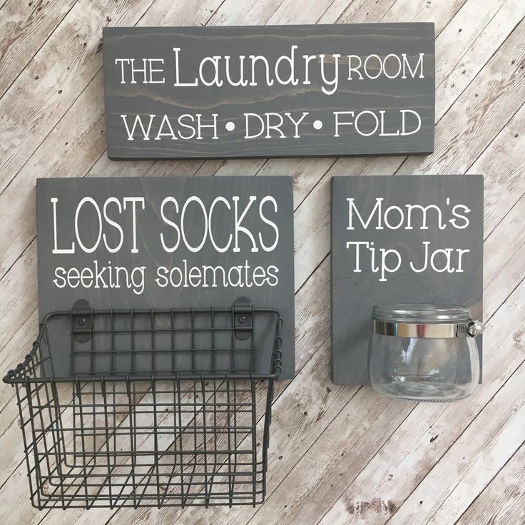 two signs on the wall that say laundry room, wash dry fold and lost socks