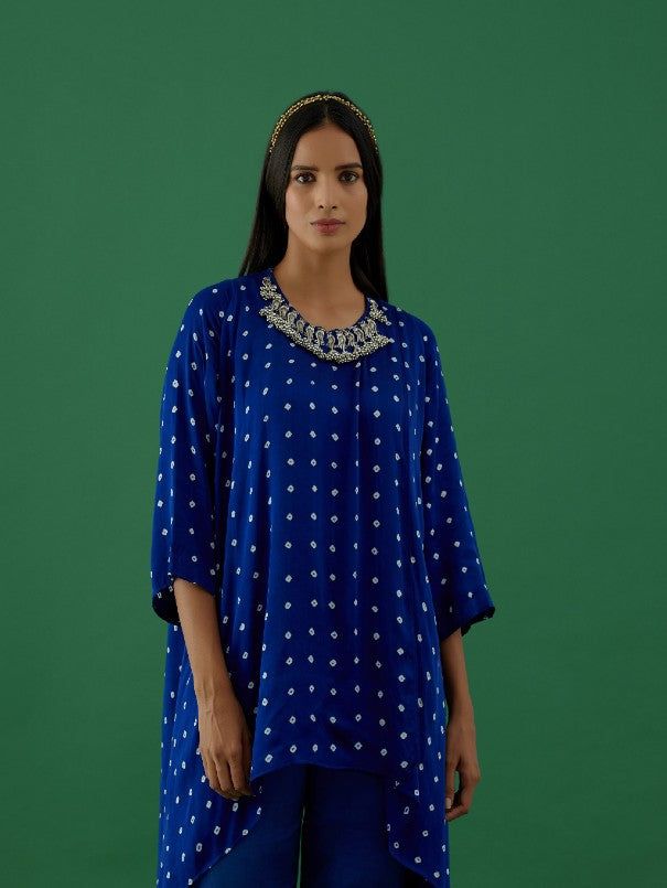 Royal Blue Ghungroo Embellished Bandhani Modal Satin Tunic By 5 Elements now available at Trendroots Blue Traditional Kurta With Gota Work, Indigo Kurta For Navratri, Indigo Kurta For Navratri Festive Season, Designer Kurta With Mirror Work For Navratri, Indigo Festive Kurta For Navratri, Kurta With Mirror Work For Navratri, Festive Indigo Kurta For Navratri, Indigo Traditional Wear With Chikankari For Festive Occasions, Bollywood Style Festive Indigo Kurta