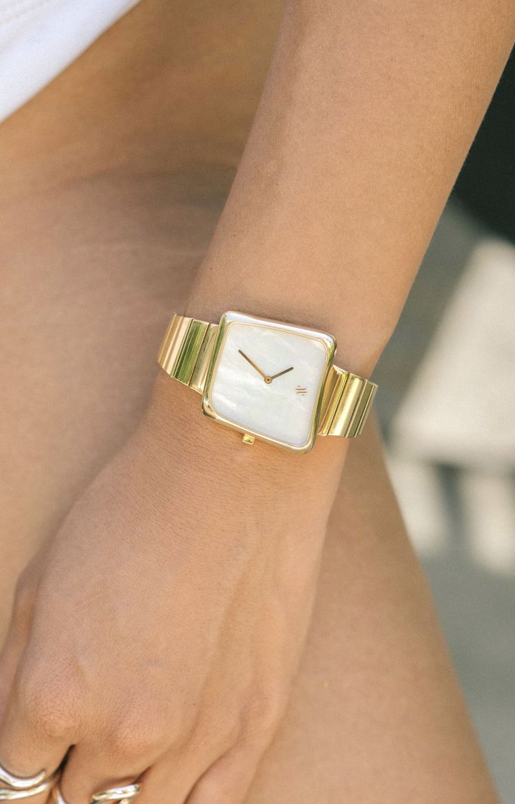 The asymmetric case of Nebula was inspired by gas clouds in space which are devoid of specific shape or form. The genuine white mother of pearl dial beautifully contrasts the polished gold bracelet. Watches Woman, Unique Watches Women, Gold And Silver Watch, Pearl Watch, Accessory Ideas, Rich Girl Aesthetic, Make Your Own Jewelry, Diy Rings, Art Appreciation