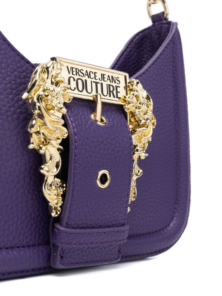 Find VERSACE Shoulder Bag on Editorialist. This Versace Jeans Couture shoulder bag features a gold-tone buckle, logo-engraved hardware, and an adjustable detachable shoulder strap. The bag also has a single chain-link top handle and a main compartment with an internal logo plaque. Versace Handbags, Versace Couture, Versace Jeans Couture, Purple Bags, Versace Jeans, Chain Link, Top Handle, Versace, Shoulder Strap