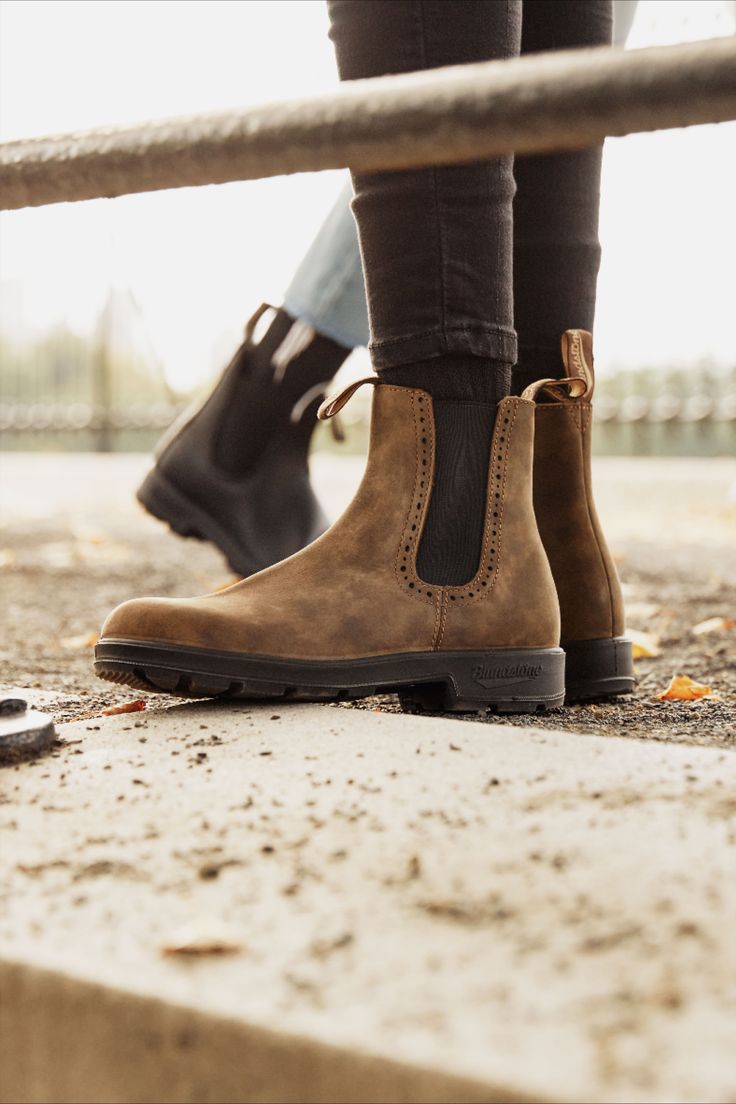 Iconic with a touch of flair, the #1351 boots combine signature rustic brown leather and brogue accent detailing. Designed for superb comfort and durability. #blundstone #leatherboots Brown Chelsea Ankle Boots For Outdoor, Brown Ankle Chelsea Boots For Outdoor, Brown Waterproof Boots With Round Toe For Fall, Brown Outdoor Ankle Chelsea Boots, Brown Waterproof Boots For Fall With Round Toe, Rugged Chelsea Boots For Outdoor Fall Activities, Brown Waterproof Boots With Reinforced Heel For Fall, Brown Outdoor Boots For Fall, Fall Waterproof Boots With Reinforced Heel