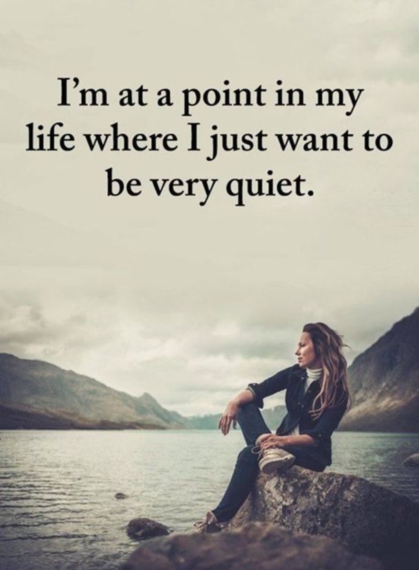 a woman sitting on top of a rock next to the ocean with a quote about life