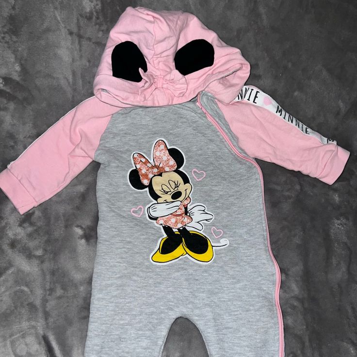 Disney Baby Minnie Mouse Zip Up One Piece Bodysuit Gray And Pink Size: 24 Months One Available Like Brand New Long Sleeve Pink Onesie With Cartoon Print, Pink Long Sleeve Onesie With Cartoon Print, Cute Pink Onesie With Cartoon Print, Playful Pink Winter Onesie, Pink Character Print Onesie For Playtime, Pink Playful Onesie With Character Print, Playful Pink Onesie With Character Print, Cute Pink Onesie With Character Print, Cute Pink Hooded Onesie