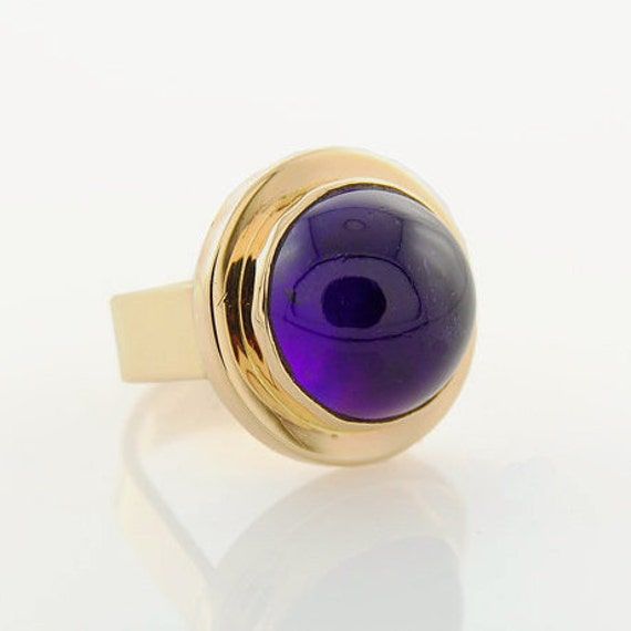 Brazilian Amethyst's deep purple color has always been one of my favorite choices when it comes to these hues.  The richness and liveliness always stimulates an inspiration to create something unique and different.  Well, here is a ring that I feel meets that criteria.  This hand cut  15 mm Round Cabochon demands everything that follows must be suited to this singular piece. I guess that's what spurs inspiration on and on.  In ancient times, the legend was that Amethyst prevented intoxication an Deep Purple Color, Rich Purple, Cabochon Ring, February Birth Stone, Jewelry Packaging, Amethyst Ring, Deep Purple, Statement Ring, Ring Set