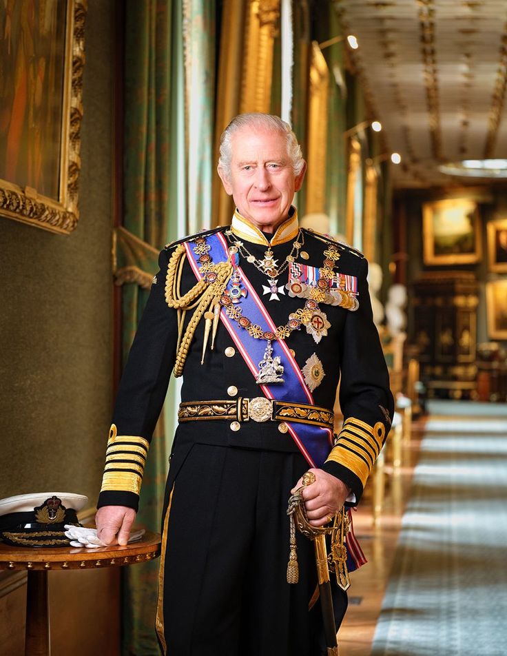 an older man in uniform standing next to a table