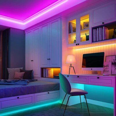 a bed room with a neatly made bed and purple lights on the ceiling above it