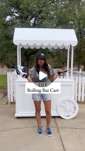 a woman standing in front of a white cart with food on it and text reading diy rolling bar cart