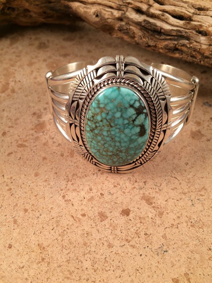 ARTISAN : Eugene Belone METAL : Sterling Silver JEWELRY TYPE : Bracelets SIGNED? : Signed MAIN STONE : Spider Web Turquoise TRIBAL AFFILIATION : Navajo This Navajo handmade bracelet is quite unique with Sterling Silver and Spider Web Turquoise the artist is Eugene Belone and stamped sterling Bracelet is right at 2 inches wide across inside is 5 inches with a 1 inch gap this piece is signed. Please contact me with any questions you may have and again thank you for looking at my items. Exported By Southwestern Turquoise Jewelry For Weddings, Artisan Turquoise Engraved Bracelets, Artisan Turquoise Engraved Bracelet, Artisan Turquoise Round Bracelet, Engraved Turquoise Jewelry Bracelet, Engraved Turquoise Bracelet Jewelry, Engraved Turquoise Bracelet, Southwestern Turquoise Gemstone Bracelets, Southwestern Blue Oval Bracelets