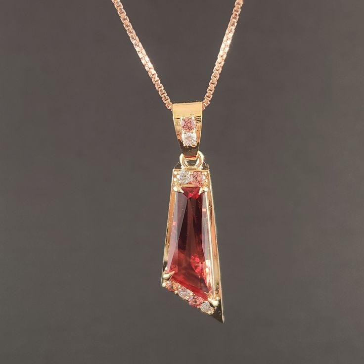 The beauty of Oregon Sunstone is etevated to new heights in this exquisite Pendant, Handcrafted with 14kt Gold, diamonds ,and sapphires, making it a truly one-of-kind-of jewelry that will be treasured for years to come. Oregon Sunstone: 2.89 ct 18 x 6.5 mm. Sapphires:0.18 ct 1.8 mm 4 qty. Diamonds: 0.11 ct 1.8 mm4 qty. Gold: 2.62 g 14 ky. Exquisite Yellow Gold Diamond Gemstones, Gold Diamond Gemstones With Accent Stones, Yellow Gold Pendant Jewelry With Accent Stones, Yellow Gold Cubic Zirconia Gemstones With Accent Stones, Formal Fine Jewelry With Trillion Cut, Formal Trillion Cut Fine Jewelry, 14k Gold Necklaces With Accent Stones For Formal Occasions, Formal Yellow Gold Necklace With Accent Stones, Yellow Gold Jewelry With Gemstone Accents In Baguette Cut