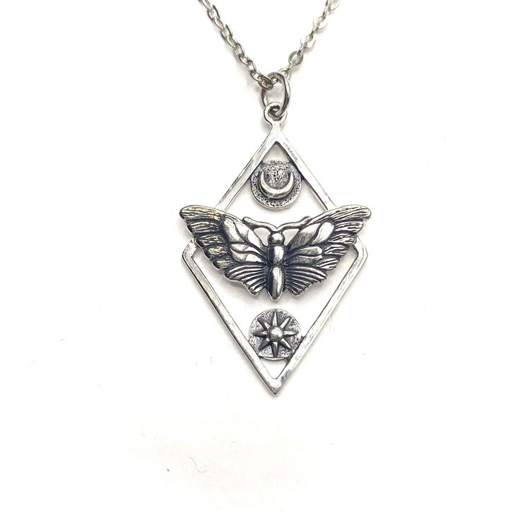 Beautiful 3D sterling moth, sun and moon  symbolism pendant . This is a necklace for new beginnings.  Moths are night creatures, who are driven by the light of the moon.  The female's release of chemicals draws mates to her even in the darkest of nights, moths are deeply tied to passionate pursuits and matters of the heart. . A meaningful gift .   Comes in a gift box.   Made out of sterling silver .   Unisex   Adjustable chain   Pendant : 24x20mm Chain 16+2 chain  Metal: Silver   Condition: New Collection: Etsy Collection Designer: Lina Mellberg Metal: Gold  Condition: New Collection: Etsy Collection Designer: Lina Mellberg Sterling Silver Sun And Moon Spiritual Necklace, Spiritual Sterling Silver Sun And Moon Necklace, Sterling Silver Spiritual Necklace With Sun And Moon Design, Spiritual Sterling Silver Necklace With Sun And Moon Design, Sterling Silver Celestial Pendant Charm Necklace, Bohemian Sterling Silver Pendant Charm Necklaces, Spiritual Silver Moon Charm Necklace, Sterling Silver Sun And Moon Pendant Charm Necklace, Silver Celestial Nickel-free Charm Necklaces