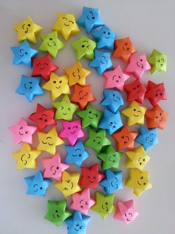 many different colored stars with faces drawn on them