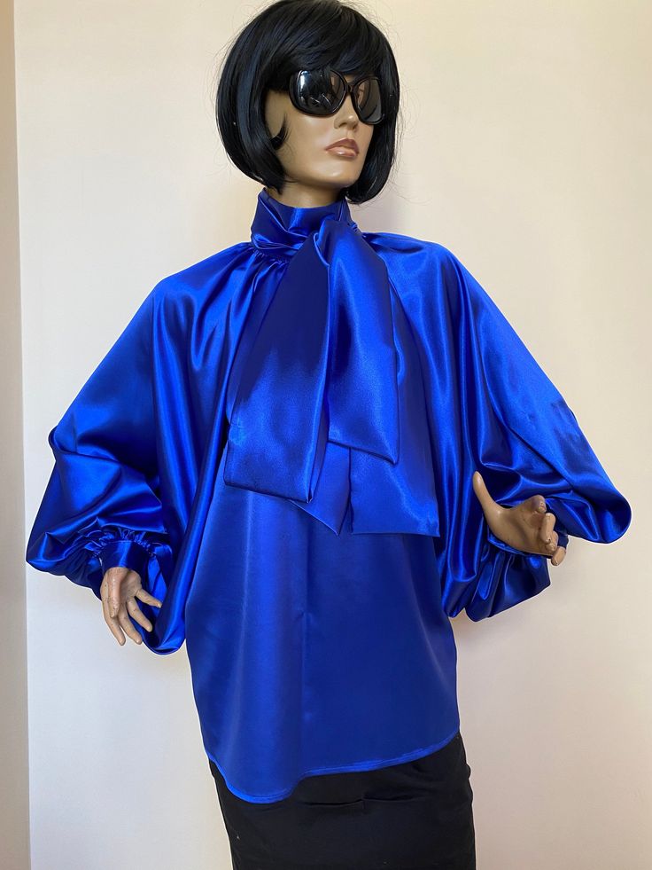 "This is a very stylish Womens Satin blouse. It is comfortable and cozy. Made for a free flowing fit. Great for all year around and for any special occasion or casual day can be dressed up or dressed down. SIZE CHART SIZE S - US 6, UK 8, EU 36 bust: bust around 34.5\"/90cm Waist: waist around 27.5\"/70cm Hips: hips around 34.5\"/90cm SIZE M - US 8, UK 10, EU 38 bust: bust around 37.5\"/95cm Waist: waist around 29.5\"/75cm Hips: hips around 37.5\"/95cm SIZE L - US 10, UK 12, EU 40 bust: bust arou Elegant Spring Tops With Satin Bow, Elegant Tops With Satin Bow For Spring, Spring Evening Blouse With Bow Detail, Spring Evening Blouse With Bow, Silk Tie Neck Blouse With Bow, Spring Party Tops With Satin Finish, Evening Tie Neck Top With Bow, Spring Party Tie Neck Blouse, Spring Silk Blouse With Bow