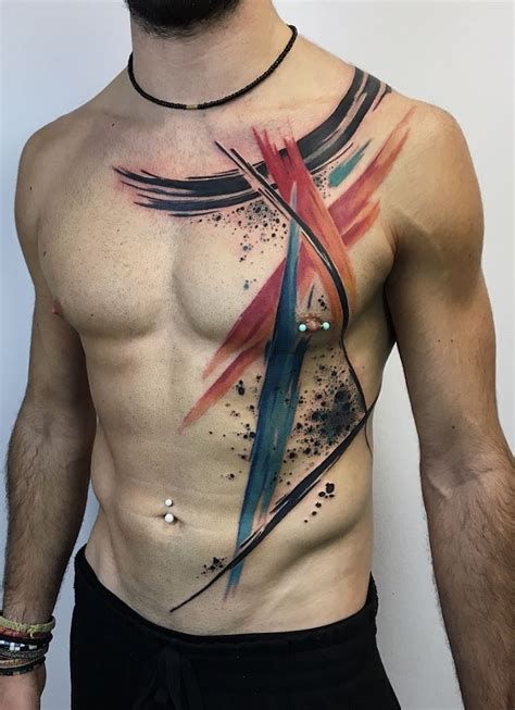 a man's chest with an abstract tattoo design on the side and back part