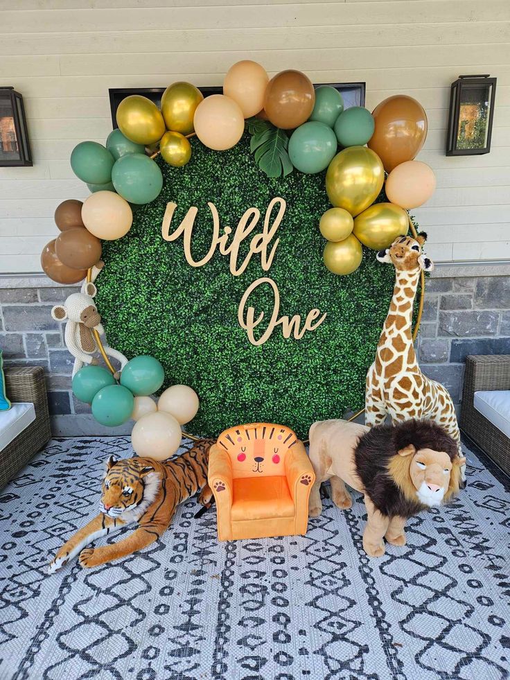 an animal themed birthday party with balloons and decorations