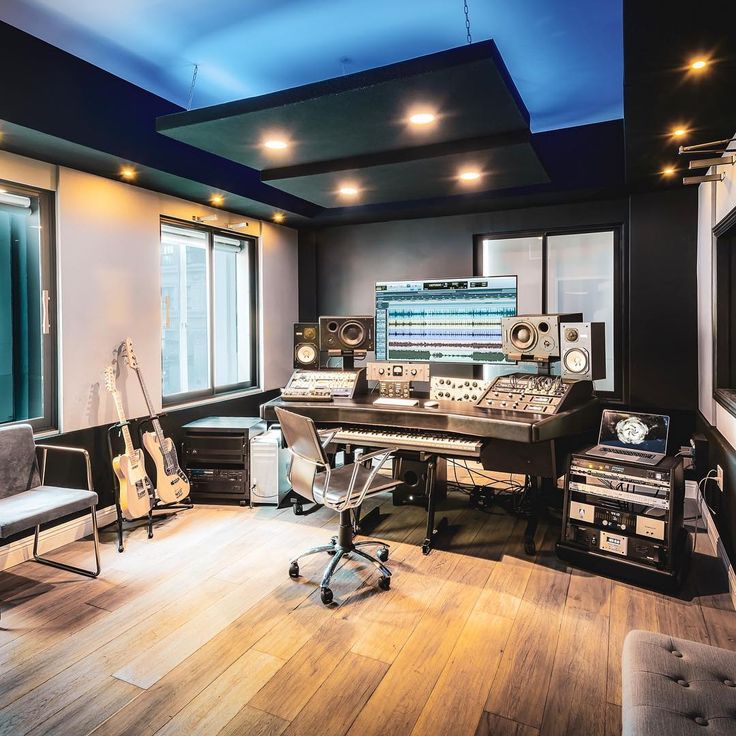 a recording studio with many equipment and lights