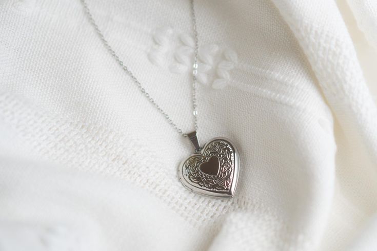 Surprise your loved one with this beautifully designed Heart Locket Necklace.  It's the perfect keepsake gift for your girlfriend, wife, mother, grandmother, or grandkid. Show them some love with this unique and elegant necklace. * How To Order 1. Choose the size. 2. Select initials, if you do not want any initial, select "NONE" (UPPER CASE and HEART Shape Available) if you want LOWERCASE please message me BEFORE placing the order!) 3. Add to cart and submit order :) * Pendent: Ion Plating(IP) 3 Elegant Personalized Locket Necklace For Mom, Heart Cut Locket Necklace For Mother's Day Anniversary, Heart Cut Locket Necklace For Anniversary And Mother's Day, Elegant Engraved Locket Necklace For Mom, Elegant Engraved Locket Necklace Gift For Mom, Elegant Engraved Locket Necklace As Gift For Mom, Heart Cut Locket Jewelry Gift, Elegant Heart Cut Locket Necklace For Mother's Day, Heart Shaped Stainless Steel Jewelry For Mother's Day