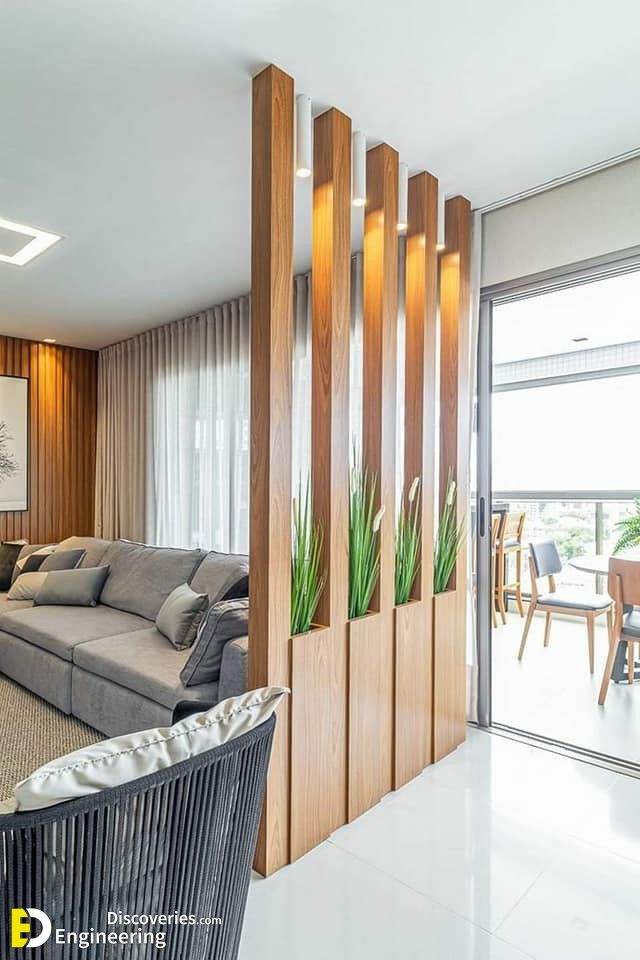 a living room filled with furniture next to a sliding glass door