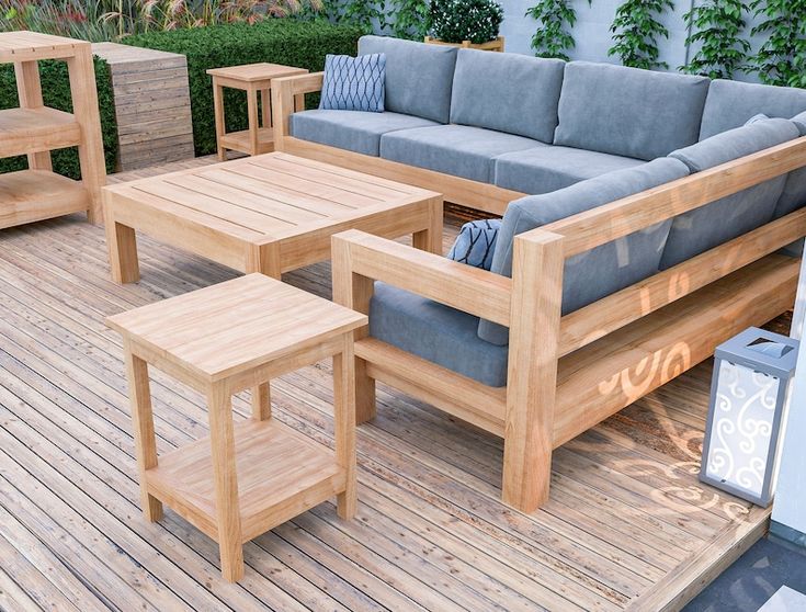 a wooden deck with couches and tables on it