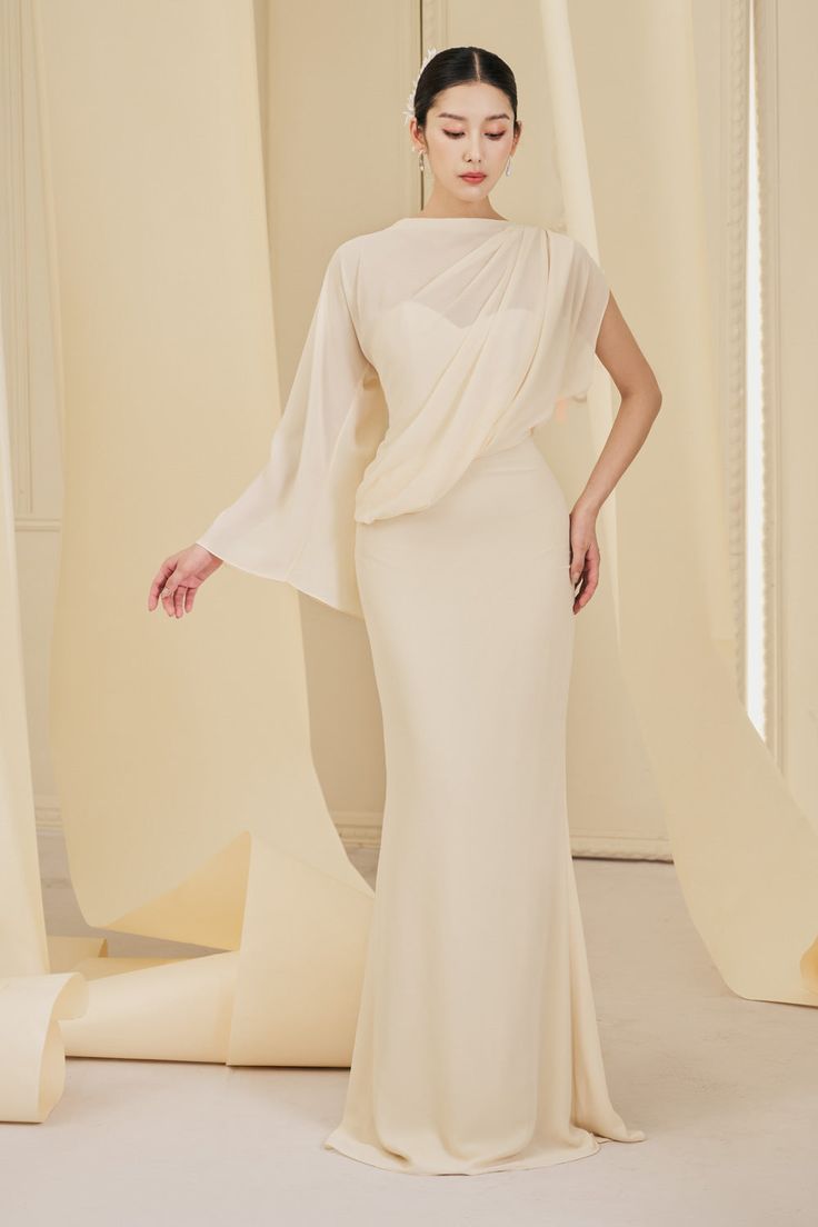 The flowing chiffon fabric and unique asymmetrical sleeves create a sophisticated and exclusive look. Perfect for formal occasions, this dress will make you stand out and feel like a true fashionista. Formal Chiffon Maxi Dress With Sheer Sleeves, Draped Chiffon Evening Dress, Chiffon Draped Evening Dress, Elegant Maxi Length Evening Dress In Georgette, Elegant Maxi Length Georgette Evening Dress, Evening Dress With Sheer Chiffon Sleeves, Chiffon Cocktail Dress With Sheer Sleeves, Formal One-shoulder Flowy Dress, Elegant Asymmetrical Hem Evening Dress For Wedding