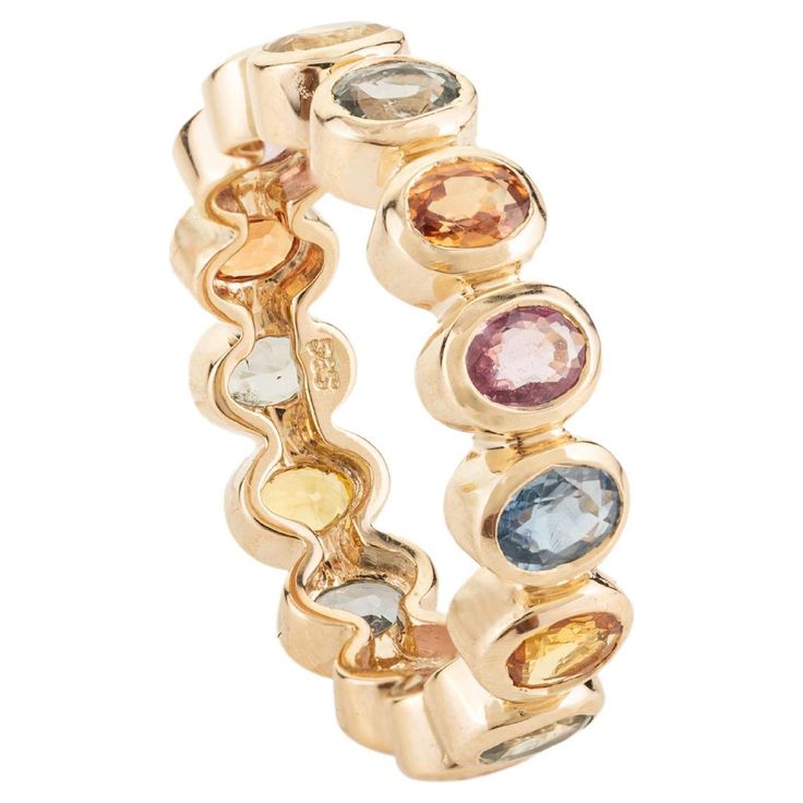 Rainbow Sapphire Bezel Set Eternity Band Ring in 14k gold symbolizes the everlasting love between a couple. It shows the infinite love you have for your partner. The round shape represents love which will continue and makes your promises stay forever. Sapphire stimulates concentration and reduces stress. Lightweight and gorgeous, this is a perfect Handmade Jewelry, Bridal Shower Gift, Girlfriend Gift, Gift For Sister, Mother Daughter Gift, Bride To Be Gift, Bridesmaid Gift, BFF Gift, Best Friend Gift, Anniversary Present, Wife Gift, Sister Gift or any Holiday Gift for Mother, Sister, Daughter, Grandma, Fiancé, Girlfriend, Valentine, Family or Friend on your list. Show your endless love by gifting this band to your partner and make her feel even more special. PRODUCT DETAILS :- Material - 1 Stay Forever, Bff Gift, Rainbow Sapphires, Mother Daughter Gifts, Infinite Love, Gift Sister, Multi Sapphire, Gold Gemstone Ring, Gift Girlfriend