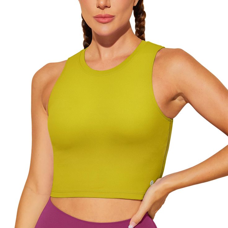 PRICES MAY VARY. Padded sports bra with removable pads for convenient adjustment. Made with high-quality nylon material with an added spandex elastic fiber which is thick but soft, sweat-wicking and not to shrink. This sleeveless crop top is pullover designed with no clasps or hooks, well constructed and seamed to be durable.High neck for added coverage. Yoga bra combine fashion, function and performance. Suitable for yoga, Pilates, fitness and any other types of exercises and workouts, or as th Functional Sleeveless Crop Top With Built-in Bra, Stretch Tank Sports Bra With Built-in Padding, Tank Sports Bra With Built-in Padding For Workout, Stretch Sleeveless Tank Top With Built-in Padding, Sleeveless Sports Bra With Built-in Padding For Yoga, Green Sports Bra With Built-in Padding For Pilates, Functional Tank Sports Bra For Light Sports, Yoga Tank Top With Built-in Padding, Green Sleeveless Sports Bra With Built-in Bra