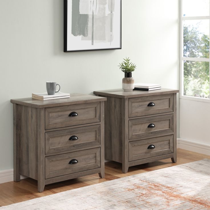 two wooden drawers sitting on top of a hard wood floor next to a white wall