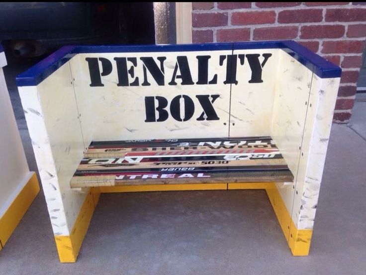 a bench made out of an old wooden box with the word penalty box painted on it